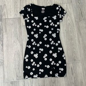 Ladies black dress with white daisy design